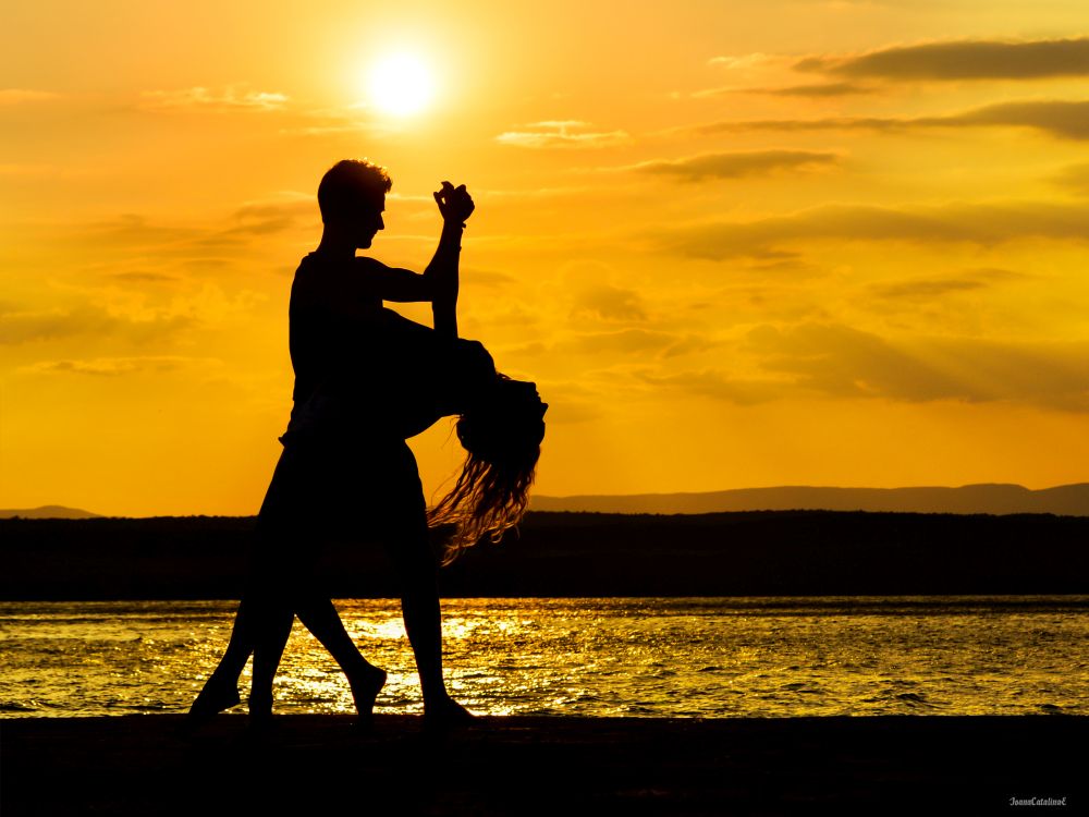 Romantic dance at sunset